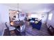 Open-concept living and dining area with gray walls and wood-look floors at 105 47Th Avenue W Dr # 377, Bradenton, FL 34207
