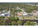 A high aerial view of this home, pool, canal and surrounding neighborhood at 108 Mccabe St, Port Charlotte, FL 33953