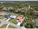 Stunning aerial view of waterfront homes on a canal, with lush landscaping and private boat docks at 108 Mccabe St, Port Charlotte, FL 33953