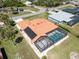 Stunning aerial view highlights the screened pool and beautiful terra cotta roof of this exceptional property at 108 Mccabe St, Port Charlotte, FL 33953