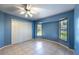 Bedroom with a large closet, bay window, and neutral tile flooring at 108 Mccabe St, Port Charlotte, FL 33953