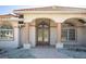 Elegant entryway with a glass double door, arched windows, and decorative columns offering great curb appeal at 108 Mccabe St, Port Charlotte, FL 33953