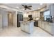 Modern kitchen featuring white cabinets, stainless steel appliances, granite countertops, and center island at 108 Mccabe St, Port Charlotte, FL 33953