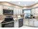 This well-equipped kitchen offers stainless steel appliances, lots of counter space and custom cabinets at 108 Mccabe St, Port Charlotte, FL 33953