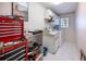 Functional laundry room with sink, cabinets, and washer/dryer hookups at 108 Mccabe St, Port Charlotte, FL 33953