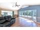 Spacious living room showcasing a bay window with backyard views and comfortable seating at 108 Mccabe St, Port Charlotte, FL 33953