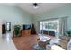 Open-concept living room with sliding glass doors that lead to the pool, seamlessly blending indoor-outdoor living at 108 Mccabe St, Port Charlotte, FL 33953