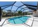 A beautiful private screened pool with sun-drenched white pavers, perfect for swimming and outdoor enjoyment at 108 Mccabe St, Port Charlotte, FL 33953