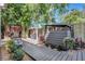 Well maintained backyard with wooden walkway, garden and privacy fencing at 1135 Florida Ave, Sarasota, FL 34236