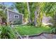 Lush green backyard with artificial grass and well-maintained landscaping at 1135 Florida Ave, Sarasota, FL 34236
