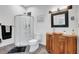 Stylish bathroom boasting a unique vanity, sleek shower, and modern fixtures at 1135 Florida Ave, Sarasota, FL 34236