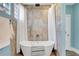 Modern bathroom showcasing a freestanding tub with stylish tile and glass block window at 1135 Florida Ave, Sarasota, FL 34236