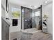 Modern bathroom featuring glass shower, creative tiling, and gray color accents at 1135 Florida Ave, Sarasota, FL 34236