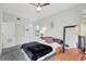 Well-lit bedroom featuring neutral tones, a ceiling fan, and a full-length mirror at 1135 Florida Ave, Sarasota, FL 34236