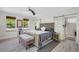 Serene bedroom featuring a bed, sliding doors, and an ensuite bathroom at 1135 Florida Ave, Sarasota, FL 34236