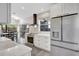 Bright kitchen featuring white cabinets, stainless appliances, and a dining area at 1135 Florida Ave, Sarasota, FL 34236