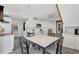 Spacious white kitchen with tile backsplash and stainless steel appliances at 1135 Florida Ave, Sarasota, FL 34236