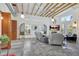 A living room with exposed beam ceiling and modern furnishings at 1135 Florida Ave, Sarasota, FL 34236