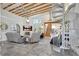 A bright living room with a spiral staircase and exposed beam ceilings at 1135 Florida Ave, Sarasota, FL 34236