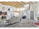 A modern living room features a spiral staircase and exposed beam ceilings, creating an airy ambiance at 1135 Florida Ave, Sarasota, FL 34236