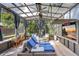 Comfortable sun room featuring a ceiling fan, television and relaxing furniture at 1135 Florida Ave, Sarasota, FL 34236