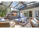 Sun room featuring a ceiling fan, television and comfortable seating at 1135 Florida Ave, Sarasota, FL 34236