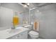 Clean bathroom featuring white fixtures, a glass-enclosed shower, and a well-lit vanity area at 1218 Spoonbill Landings Cir, Bradenton, FL 34209