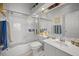 Bright bathroom with tub and shower combo, vanity, and tiled walls offering clean functional space at 1218 Spoonbill Landings Cir, Bradenton, FL 34209