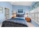 The home's bedroom offers a calming color scheme, window view, and tile floor at 1218 Spoonbill Landings Cir, Bradenton, FL 34209