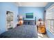 Sunlit bedroom showcasing a serene ambiance with soft blue walls, complemented by warm bedside lamps at 1218 Spoonbill Landings Cir, Bradenton, FL 34209