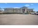View of the Perico Bay Club clubhouse featuring designated handicap parking spaces at 1218 Spoonbill Landings Cir, Bradenton, FL 34209