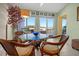 Bright dining room features large windows with views of the peaceful waterfront at 1218 Spoonbill Landings Cir, Bradenton, FL 34209