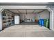 Organized open garage with ample storage shelving and visible household items, providing functionality and space at 1218 Spoonbill Landings Cir, Bradenton, FL 34209