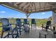 Charming screened lanai with comfortable seating, ideal for relaxing and enjoying the serene views at 1218 Spoonbill Landings Cir, Bradenton, FL 34209