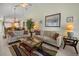 Cozy living room with comfortable seating, stylish decor, and tile flooring, creating a welcoming atmosphere at 1218 Spoonbill Landings Cir, Bradenton, FL 34209