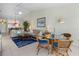 Comfortable living room featuring tile floors, ceiling fan, and an open floor plan with dining area at 1218 Spoonbill Landings Cir, Bradenton, FL 34209