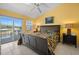 Comfortable main bedroom featuring a ceiling fan, tile floor, and a sliding door to a waterfront lanai at 1218 Spoonbill Landings Cir, Bradenton, FL 34209
