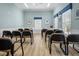 A meeting room with wood look floors and several tables at 1218 Spoonbill Landings Cir, Bradenton, FL 34209