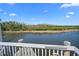 Enjoy the serene view from this patio featuring a peaceful waterfront setting at 1218 Spoonbill Landings Cir, Bradenton, FL 34209
