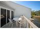 Relaxing outdoor patio with a round table and comfortable seating, overlooking a scenic waterfront view at 1218 Spoonbill Landings Cir, Bradenton, FL 34209