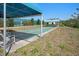Community shuffleboard court with covered seating area is perfect for outdoor recreation at 1218 Spoonbill Landings Cir, Bradenton, FL 34209