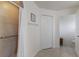 Well-lit bathroom featuring tiled shower, closet, and neutral tiled floor at 1269 Rasp Ct, North Port, FL 34288