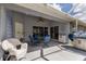 Covered lanai with dining set, grill, and tiled flooring, perfect for outdoor entertaining at 1269 Rasp Ct, North Port, FL 34288