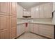 Cozy kitchen featuring classic cabinetry, tile countertops, and ample storage space at 1364 Point Crisp Rd, Sarasota, FL 34242