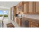 Well-appointed kitchen boasting custom cabinets, modern appliances, granite countertops, and breathtaking water view at 1364 Point Crisp Rd, Sarasota, FL 34242