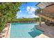 Backyard pool with nearby staircase to the home's second level at 1364 Point Crisp Rd, Sarasota, FL 34242