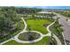 Expansive park view featuring walking paths, manicured lawns, and mature trees under a sunny sky at 14953 Contenta Loop, Bradenton, FL 34211