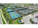 Aerial view of well-maintained tennis and pickleball courts surrounded by lush landscaping at 14953 Contenta Loop, Bradenton, FL 34211