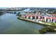 Scenic aerial view of the waterfront property complex with a pool and waterway at 1602 Stickney Point Rd # 404, Sarasota, FL 34231