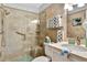 Tiled bathroom featuring glass walk-in shower and modern fixtures at 1602 Stickney Point Rd # 404, Sarasota, FL 34231